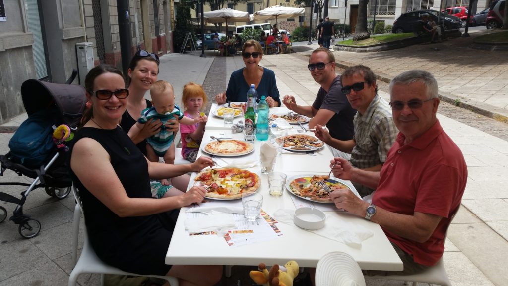 With friends, my parents and the best pizza ever, Sardinia.