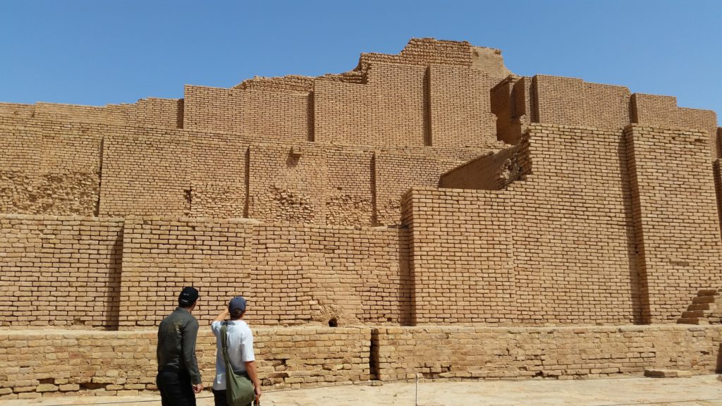 Looking at the even brick work & finding the cuneiform script. Choqa Zanbil.